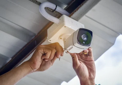 Security System Solutions technician installing cctv cameracctv camera installation