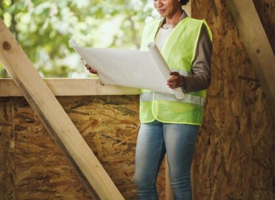 General Handyman Services shot african female architect checking plans construction site new wooden house she is wearing protective workwear white helmet 360066 21349.jpg