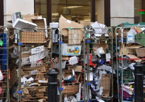 trolly full of folded cardboard waste in retail shop 768x684retail & f&b outlets